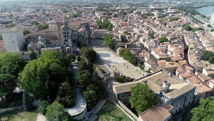 Aerial bird view of The Palais des Papes is an historical palace located in Avignon Southern France and is one of the largest and most important medieval Gothic buildings in Europe 4k high resolution
