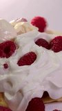 vertical video process of preparing sweet delicious waffles in electric waffle iron beat ingredient eggs flour add sugar close-up cooking show recipe. Breakfast with raspberries decorate set of videos