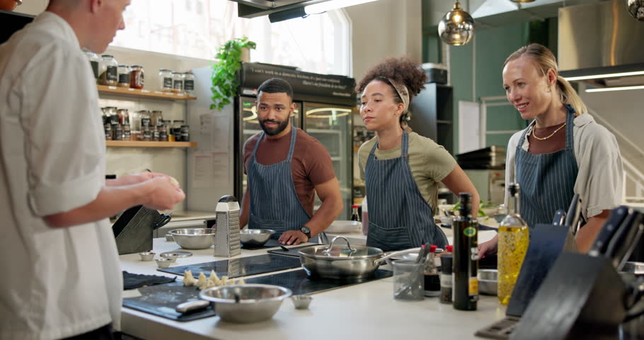 Cooking class, restaurant and students in kitchen with chef for learning, education course or practice. Gastronomy, hospitality and diverse people for culinary meal, preparation or working on skills