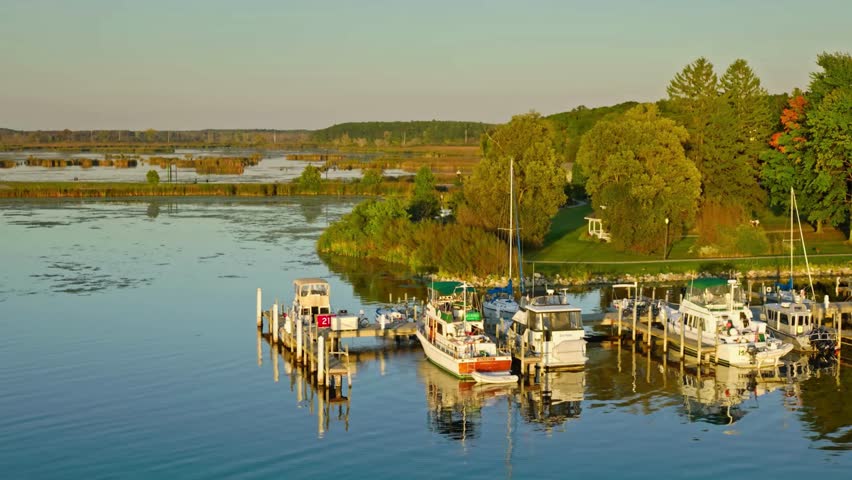 Boats on a Dock in White Lake, Whitehall, Michigan at Sunset.