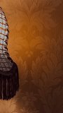 vintage antique lamp against the background of dark orange faded wallpaper close-up table lamp antique brown interior old age wealth In ancient times gilding place for text. Vintage