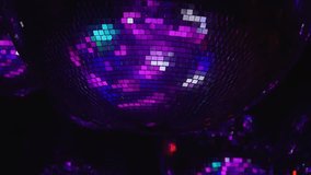 A disco ball with purple and blue lights. Scene is fun and energetic. The disco ball is the main focus of the image, and the lights surrounding it create a vibrant and lively atmosphere. Part of - Powered by Shutterstock - Get 15% off with code: PIKWIZARD15