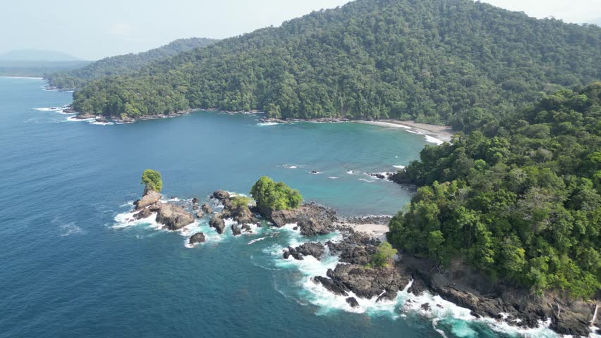 Picturesque bay with white sand beach and lush jungle backdrop in the Utría National Park near Bahía Solano in the Chocó department on the Pacific Coast of Colombia