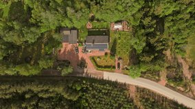 Hyperlapse drone shot of clouds moving over a solar house with people on the yard - Powered by Shutterstock - Get 15% off with code: PIKWIZARD15