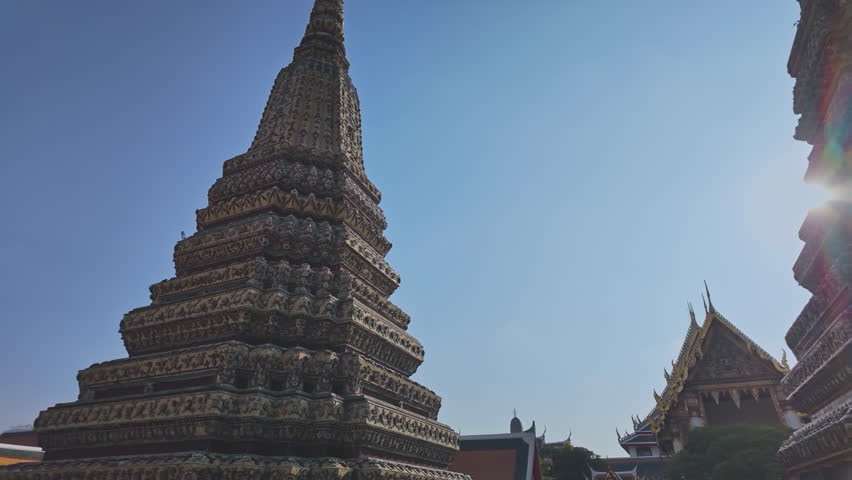 The four great pagodas are richly decorated of Wat Pho. The entrance arch is a Thai architecture applied in Chinese style. Decorated with glazed tiles Multicolor wares.Wat Pho landmark in Bangkok. 