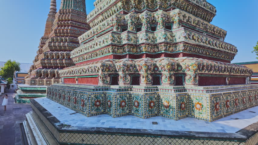 The four great pagodas are richly decorated of Wat Pho. The entrance arch is a Thai architecture applied in Chinese style. Decorated with glazed tiles Multicolor wares.Wat Pho landmark in Bangkok. 