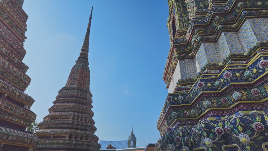 The four great pagodas are richly decorated of Wat Pho. The entrance arch is a Thai architecture applied in Chinese style. Decorated with glazed tiles Multicolor wares.Wat Pho landmark in Bangkok. 