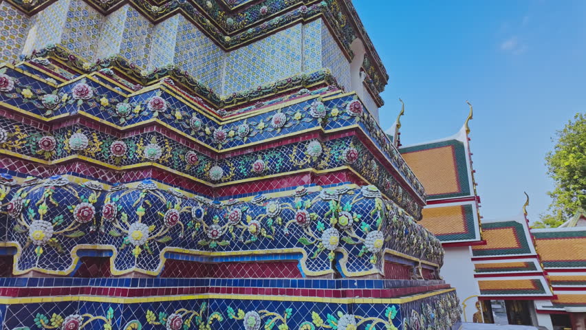 The four great pagodas are richly decorated of Wat Pho. The entrance arch is a Thai architecture applied in Chinese style. Decorated with glazed tiles Multicolor wares.Wat Pho landmark in Bangkok. 