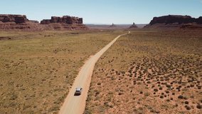 4k Drone Video Of Car driving in scenic Landscape Valley of Gods Utah