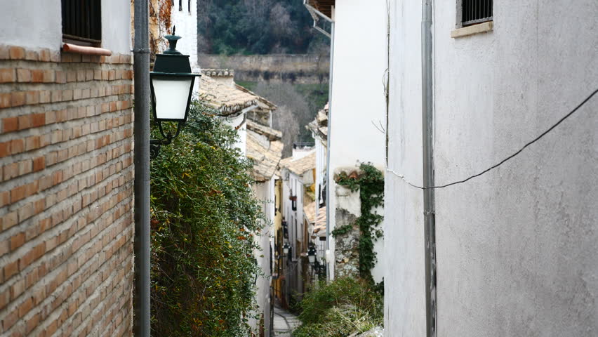 A narrow street of Granada, Andalucia, Spain. Filmed in January 2018.