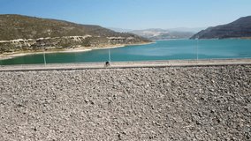 4K aerial footage of a biker from Cyprus. 4K drone sport video. Cycling on Kouris Dam