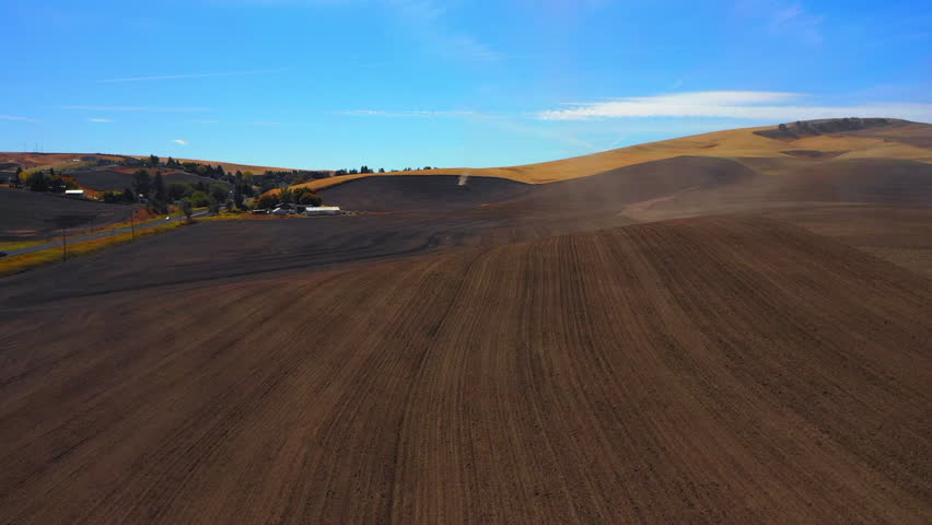 Aerial: Drone Forward Shot Of Brown Landscape Of Tranquil Hills On Sunny Day - Rural, Idaho