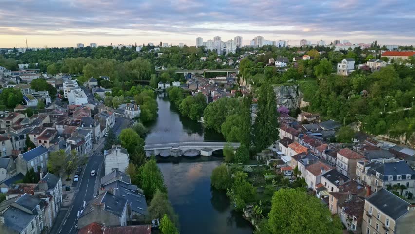 Pont Joubert bridge on Clain river at Poitiers, France. Aerial forward at sunset