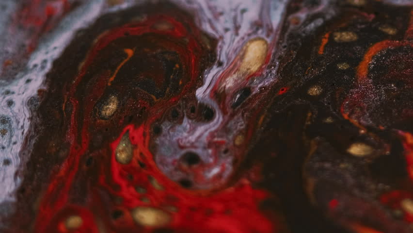 Glitter paint spill. Ink blend. Blur red gold black blue color shiny bubbles texture acrylic liquid mix cascade flow abstract art background.