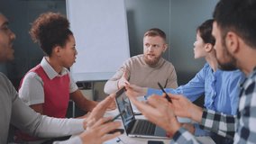 Diverse team of professionals engages in spirited debate during corporate meeting, various points of view, intense discussion, highlighting teamwork, problem-solving, and dynamic office interactions. - Powered by Shutterstock - Get 15% off with code: PIKWIZARD15