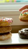 assorted donuts with different fillings and icing. Dolly video. High quality FullHD footage