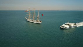 Portugal Lisbon 4k travel video. Aaerial view of city ship yacht boat sailing ship sky no clouds sailing