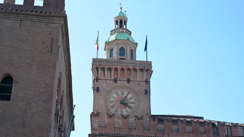 Bologna, Italy. Piazza Maggiore, main square in the city. Bologna is capital of the Emilia-Romagna region. Clock tower. 