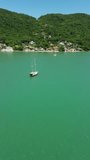 Boat on the ocean - in the coast of the island named Florianópolis, seaside on the south region of Brazil