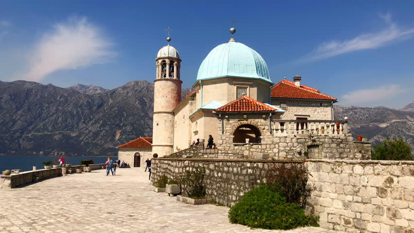 A church on an Island. The Roman Catholic Church of Our Lady of the Rocks in the Bay of Kotor off the coast of the historic town of Perast, Montenegro. Europe.