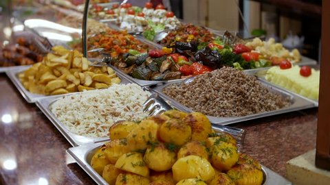 Salad Bar Buffet. dishes in the storefront. 4k, background blur. close-up