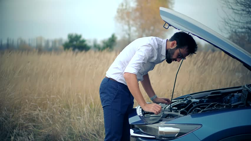 Sad Disappointed Man On Broken Car Accident.Vehicle Check Engine Oil Level.Car Engine Overheating.Open Hood Motor.Auto Failure Accident Inspection Oil Level.Frustrated Businessman Repairing Damage Car Royalty-Free Stock Footage #3494092025