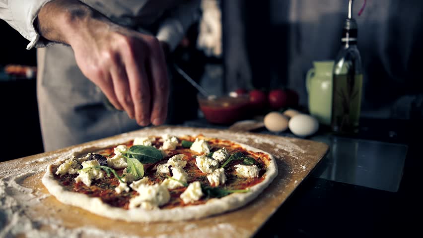 Italian Food. Traditional Pizza With Mozzarella Cheese. Dry Oregano. Pizza Margherita With Mozzarella Cheese And Tomato Sauce. Delicious Italian Food. Basil Leaves On Dish. Cooker Italian Pizza Dough