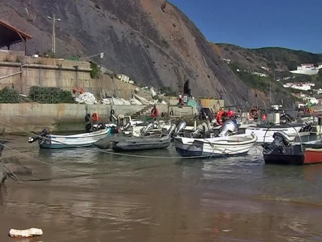 Small harbor and fishing boats  in Arifana Portugal