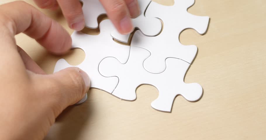 Taking white puzzle all together | Shutterstock HD Video #34941700