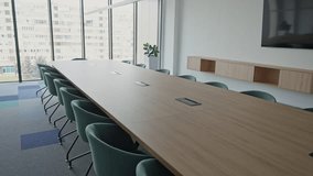 Modern Boardroom with Chairs, Table and TV. Corporate Conference Room interior with minimalist design. Comfortable seating in a contemporary workspace - Powered by Shutterstock - Get 15% off with code: PIKWIZARD15