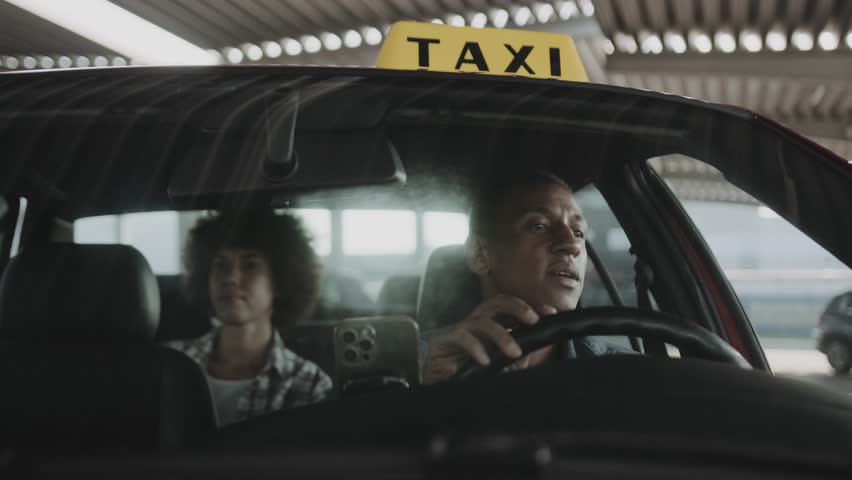 Pretty young lady giving money to male taxi driver for a ride. Slow motion