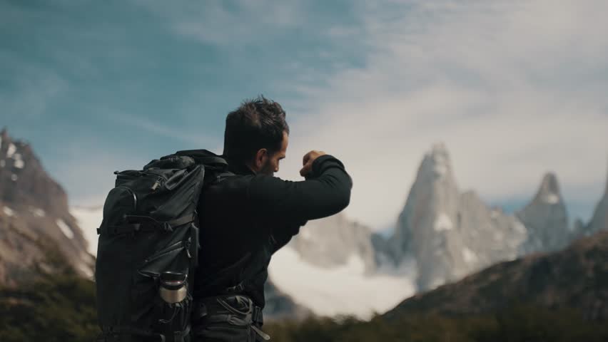 Backpacker Taking Photos Of Mount Fitz Roy Peak Near El Chalten Town In Patagonia, Argentina. Handheld Shot