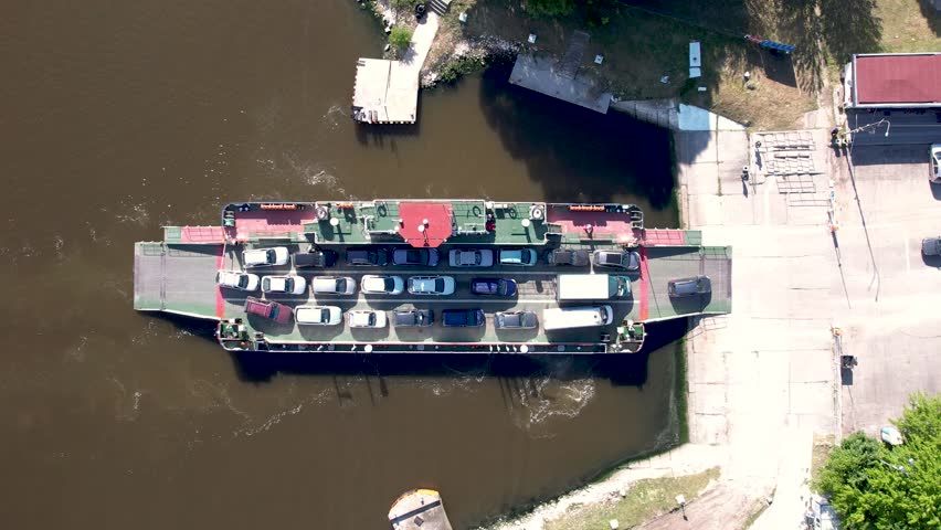 top down view of ferryboat transferring cars. Ferry transfers cars and passengers to the other side
