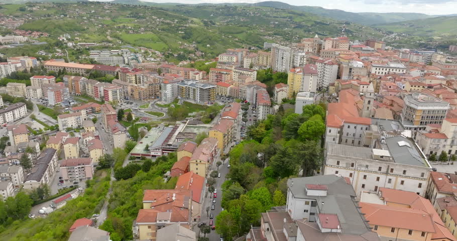 Aerial view of the historic center of the city of Potenza, in Basilicata, Italy. The houses in the old town have traditional red sloping roofs.