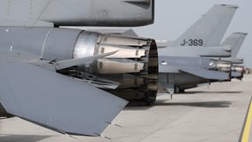 Fighter jet exhaust nozzle detail on a lot of fighter airplanes in parking position.  - Powered by Shutterstock - Get 15% off with code: PIKWIZARD15