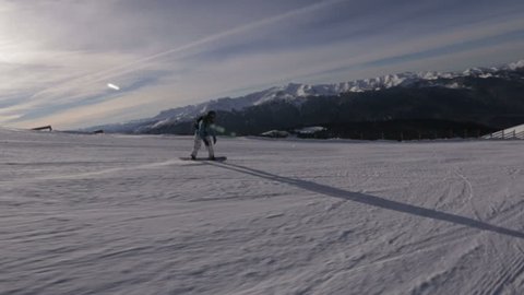 Snowboarder slides on the snow slope Arkivvideo