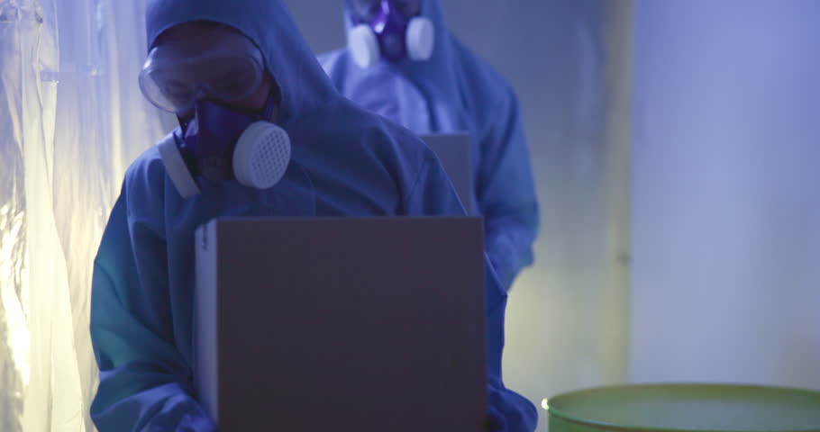 People, hazmat suit and chemical waste in box for investigation, forensic evidence and proof. Team, crime scene and ppe clothes with face mask for safety handling dangerous materials from package