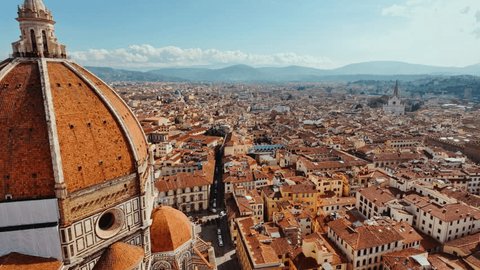 Florence seen from above, reveals a tapestry of picturesque architecture, weaving history and beauty under the Italian sun
 Stockvideó