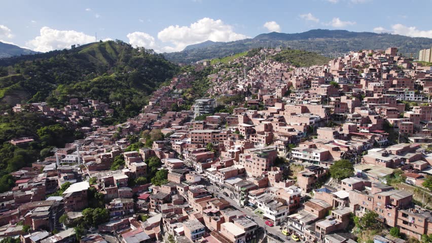Comuna 13 favela with Metrocable, Medellin Colombia - aerial flyover