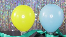 Row of colorful balloon decorations made in DIY crafts lesson for party