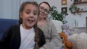 Happy family concept.mother and child at home on sofa communicate via video conference.cheerful baby on an online video call.video call with family.mother and child online via video call in quarantine - Powered by Shutterstock - Get 15% off with code: PIKWIZARD15