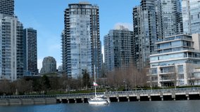 Granville Island Real life in part of Vancouver near Pacific Ocean ships people on bicycles seagulls weather relaxing sunny day in Canada 2023