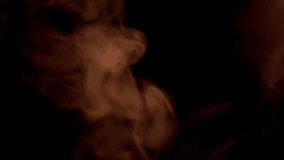 Explosion of Orange Smoke or Vapor on Black Blurred Background. Abstract. Side view. Soft puffs of smoke or steam mix chaotically on empty space. Particle explosion, bright light. Slow motion. - Powered by Shutterstock - Get 15% off with code: PIKWIZARD15