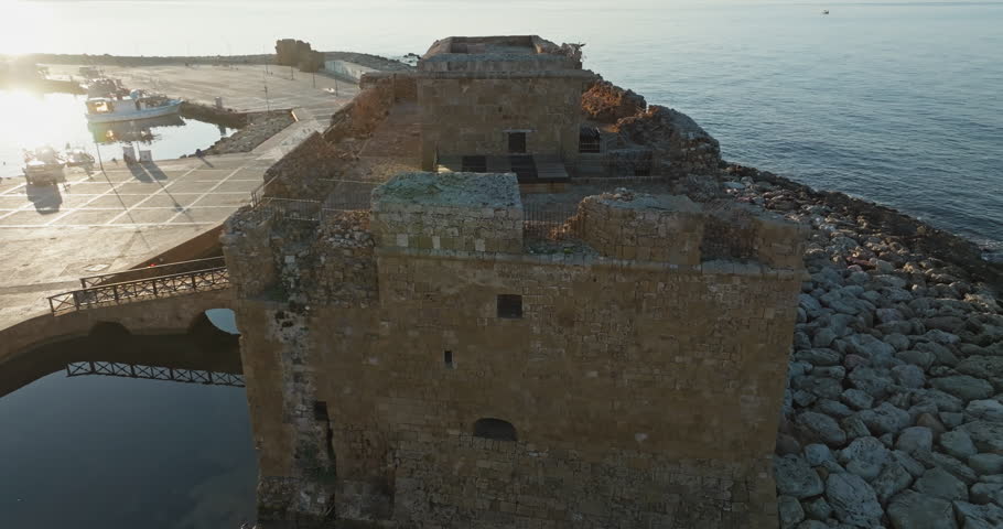 Aerial view of the fort in the castle of Paphos, Cyprus. Tourist place fort on the seashore with a beautiful stone tower. High quality 4k footage