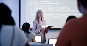 Female lecturer, coding and screen in class for education with html, teaching with technology for web development. Woman, teacher and tablet for projection to students, introduction to programming - Powered by Shutterstock - Get 15% off with code: PIKWIZARD15