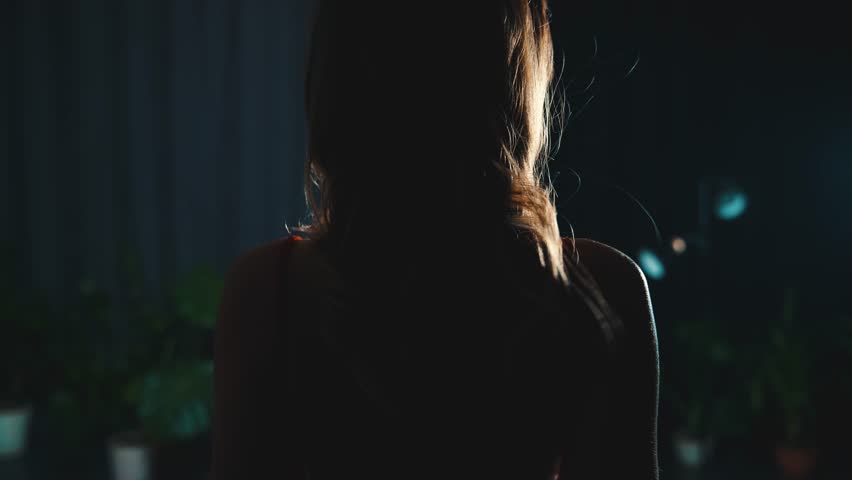 Queen Sexy fashion model woman walking in dark room Long loose Wavy curl blonde hair fly wind slow motion. Girl hair evening dress bare open back rear view, lady Beauty face elegant makeup red lips 4k