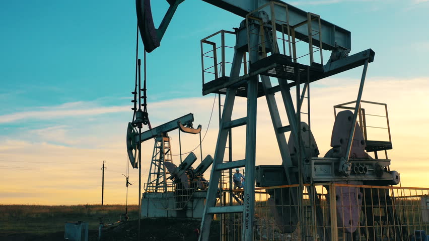 Crude oil, drilling rig, oil field, oil industry concept.
