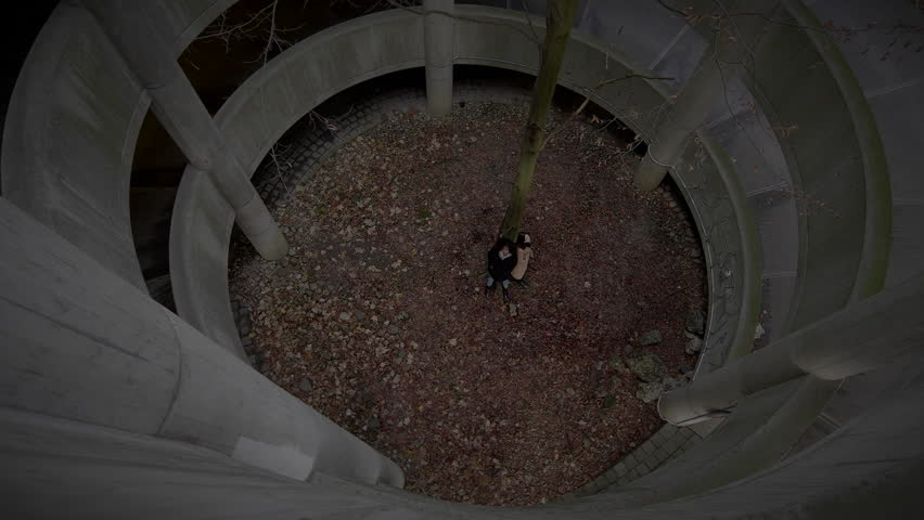 Two women standing with a faraway look in their eyes