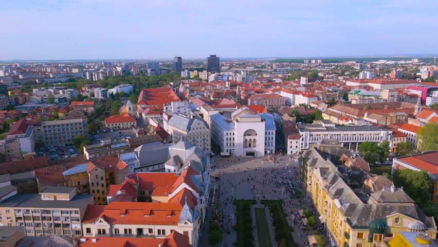 Aerial view of the beautiful city of Timisoara, Romania. Footage was shot from a drone at a higher altitude with the National Opera House and The Victory Square in the view.