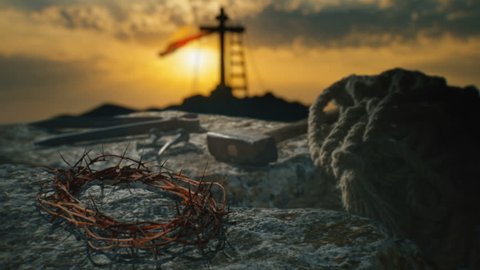Crucifixion of Jesus Christ. Crown of thorns with nails, hammer, pliers and a rope placed on a stone.